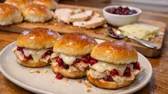 Baked Turkey & Cranberry Sliders with Swiss and a Herby Butter Glaze