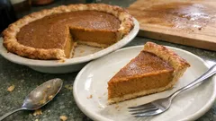 Classic spiced pumpkin pie with a smooth custard filling and crisp pastry crust