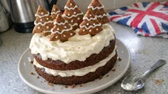 Festive gingerbread layer cake with treacle and cream cheese icing (with biscuit trees)